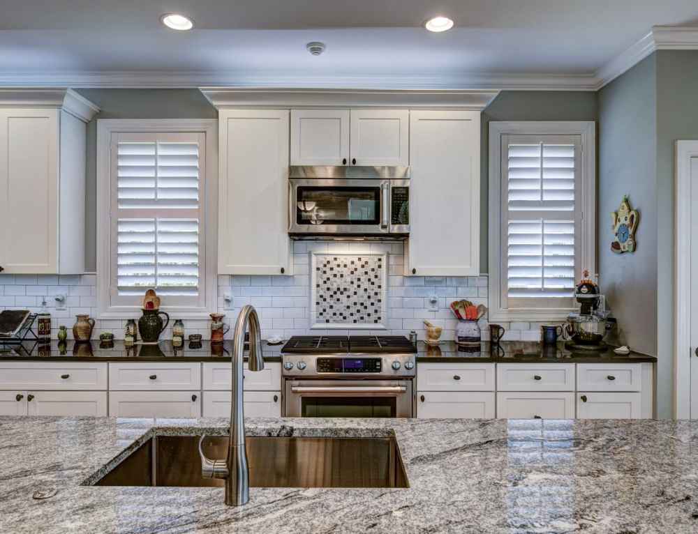 kitchen remodeling marble island, wooden floor, white kitchen, remodeling contractors glencoe