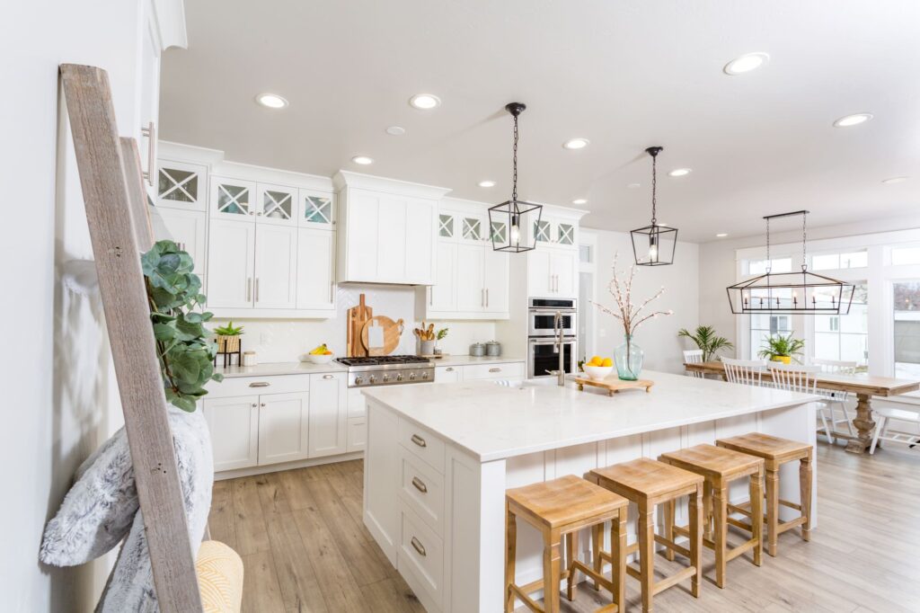 kitchen wooden hardwood floor, white kitchen island, wooden chairs, remodeling contractors barrington