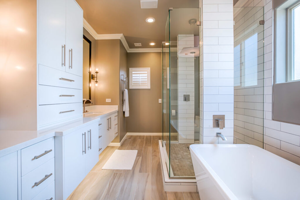 bathroom remodeling glenview il white cabinets, white bathtub, hardwood floor